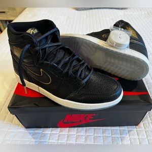 Jordan 1 Retro in black with gold trim.  Clear sole… A rare find!